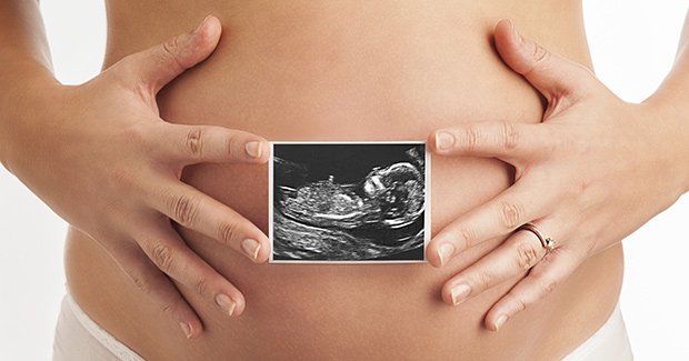 ultrasound superimposed over pregnant woman