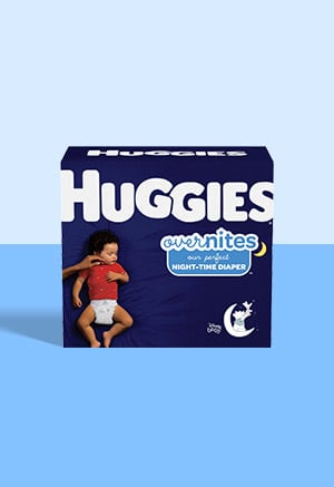 A box of Huggies Overnites night time diapers on a blue background