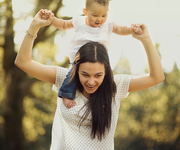 mom with baby on shoulders