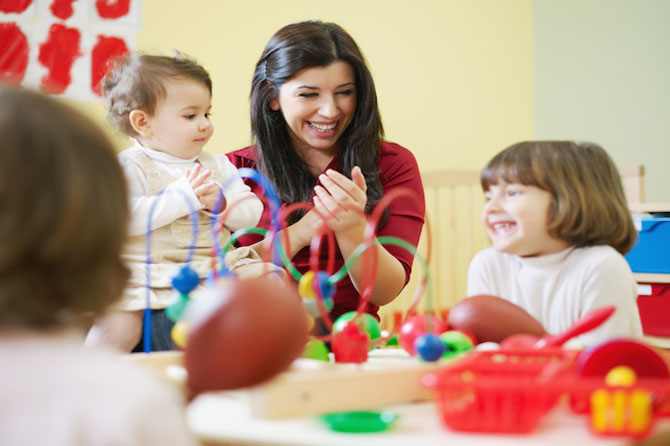 woman playing games with children